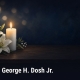 Fostoria News Memorial candle and lilies for George H. Dosh Jr. obituary.